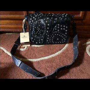 Black distressed studded Patricia Nash bag.